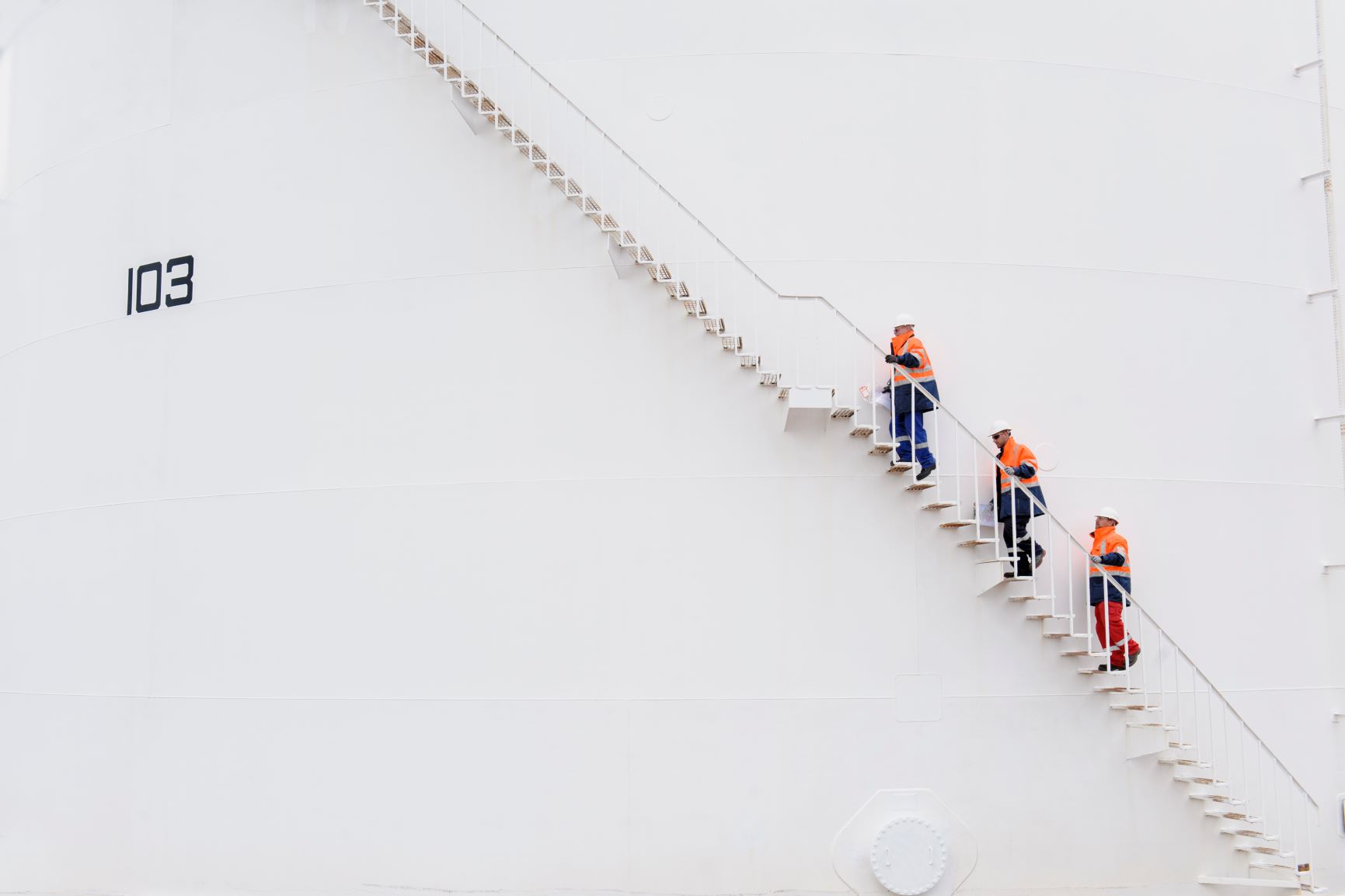 Techniciansclimbingfuelstoragetankstaircase.jpg